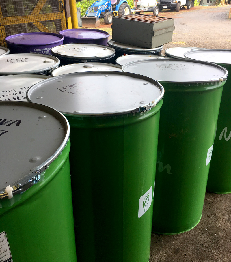 Green barrels of raw honey ready for shipping from Aloha Farms Hawaii
